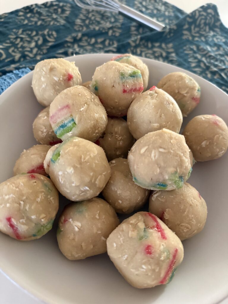 Cookie dough mixed with butter, oats, and chopped Airheads Extremes just before baking.