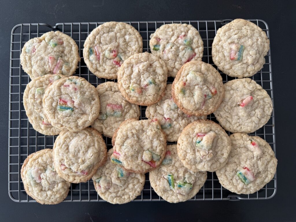 cooling rack filled with freshly baked gumdrop cookies made with airheads extremes