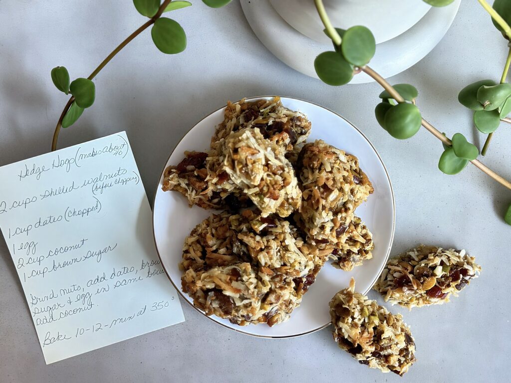 Plate of Hedge Hog cookies piled high with coconut, dates, and walnuts.
