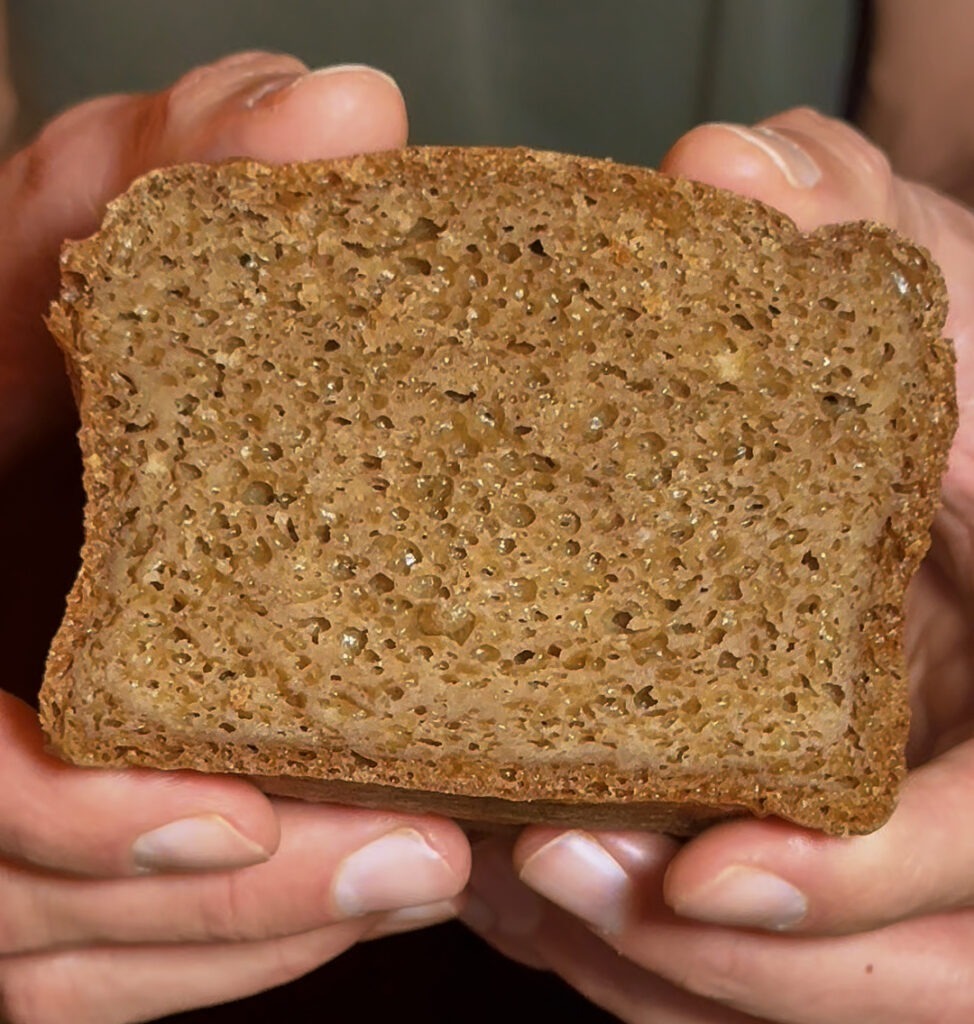 Close-up of a slice of high-protein loaf showing the tender crumb texture.