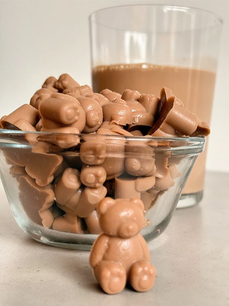 close-up bowl of homemade mocha protein gummies shaped like bears