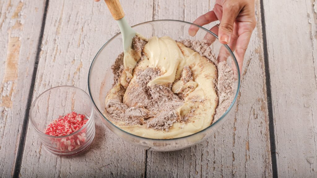folding wet mixture into dry ingredients for peppermint cottage cheese muffins