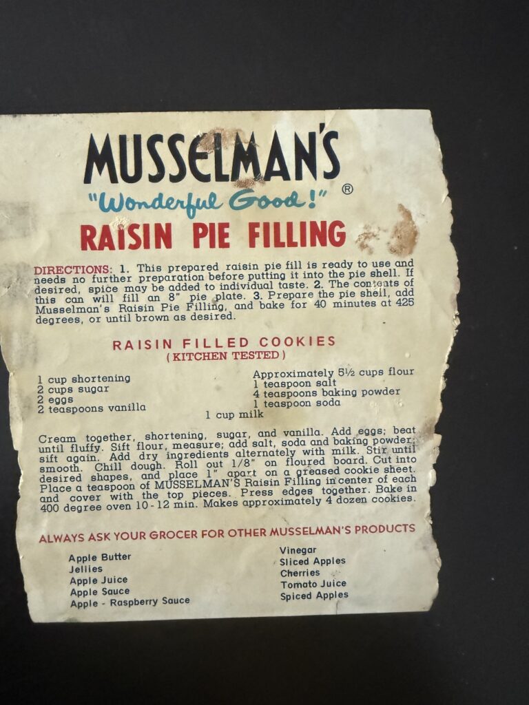 Vintage Musselman's raisin pie filling recipe card with directions for raisin filled cookies.