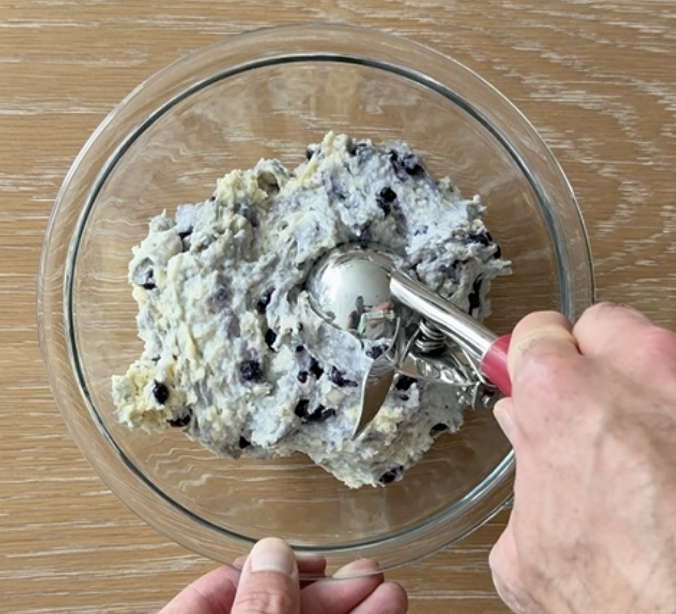 Scooping Blueberry Cottage Cheese Muffin Batter