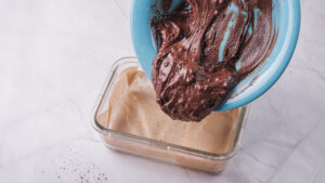 Gluten free protein brownie batter poured into baking pan
