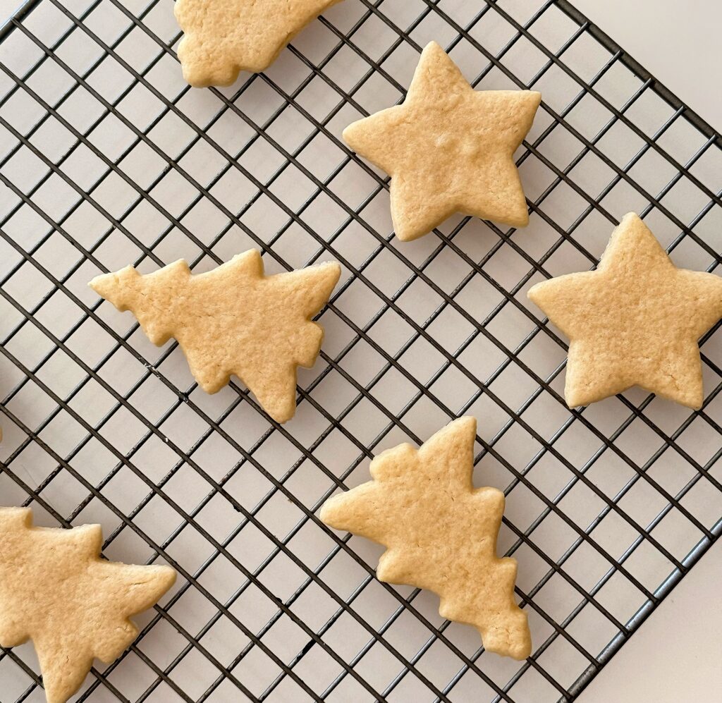 Vintage sour cream cut out cookies cooling on wire rack