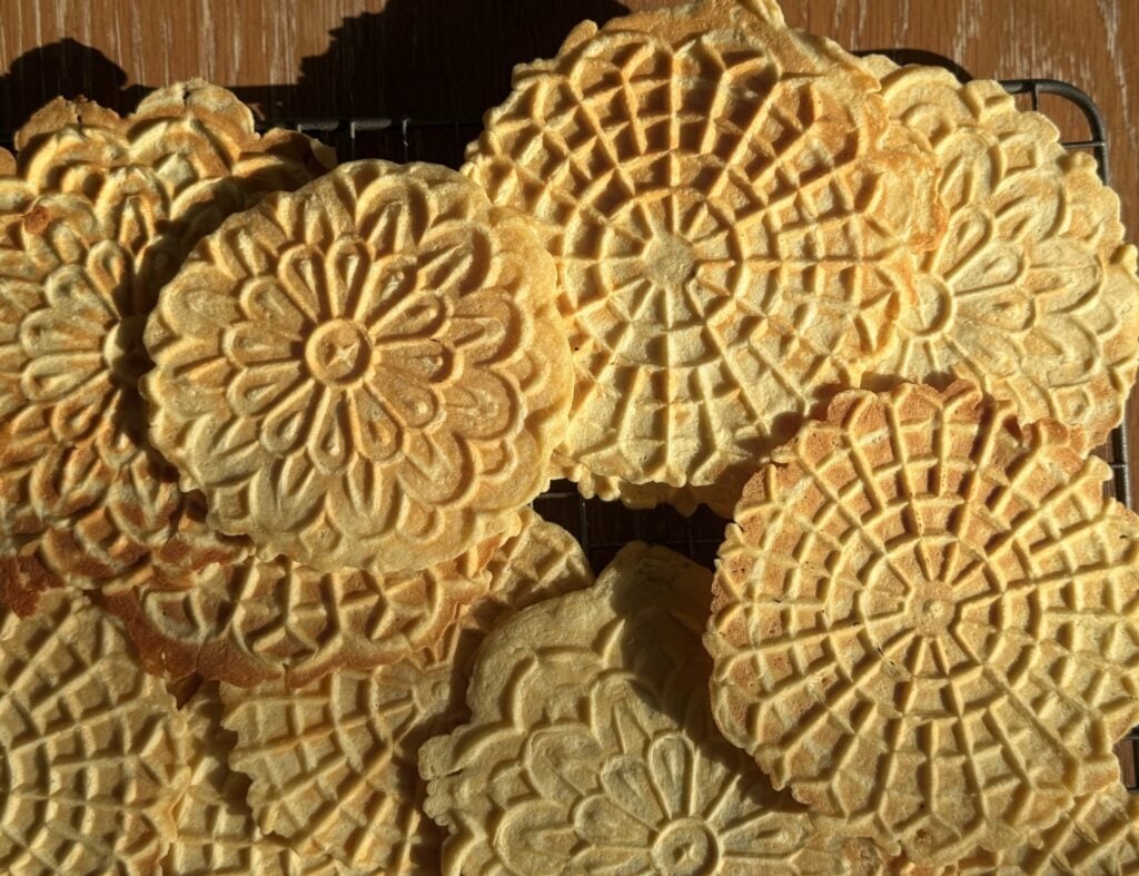 High protein pizzelle cookies cooling on wire rack