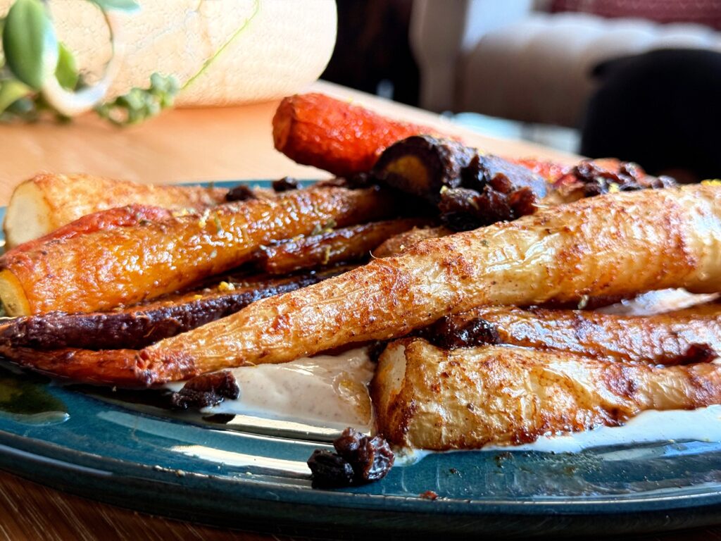 Harissa maple glazed roasted carrots served with spicy yogurt