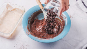Chocolate chips folded into gluten free protein brownie batter