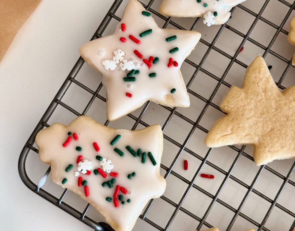 Frosted sour cream cut out cookies with sprinkles