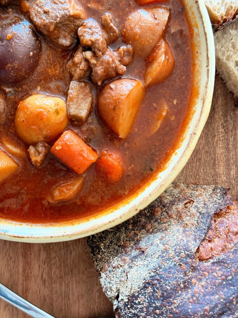 Hearty beef and lamb stew in a rustic bowl