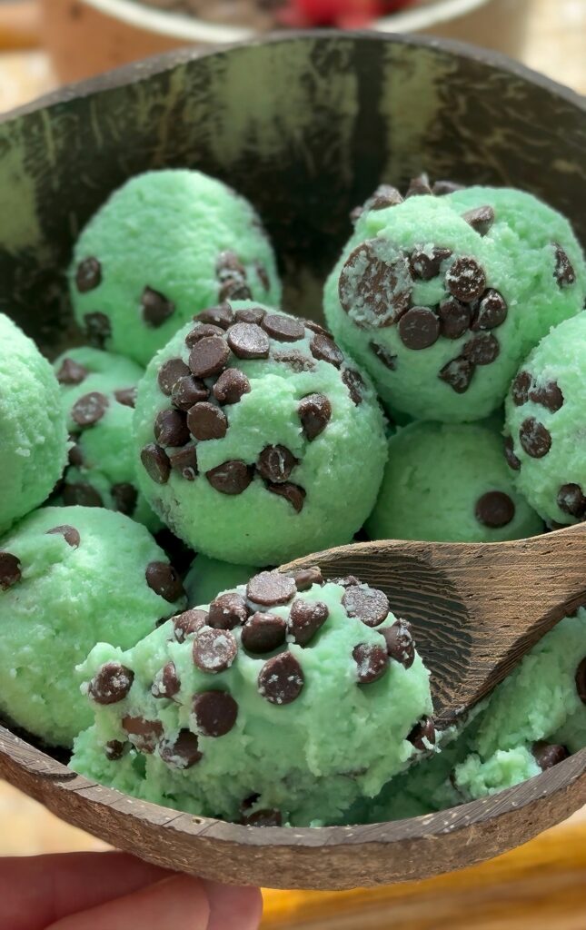 Scoop of high-protein, edible mint chocolate chip cookie dough made with cottage cheese.