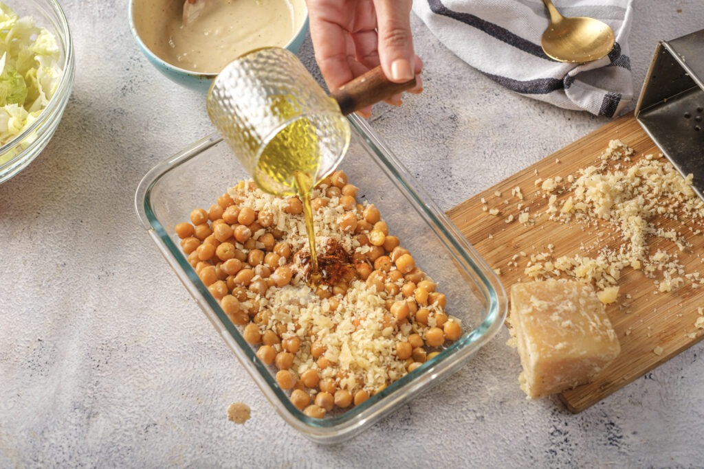 Drizzle of olive oil helps the chickpeas get perfectly golden and crispy in the oven.