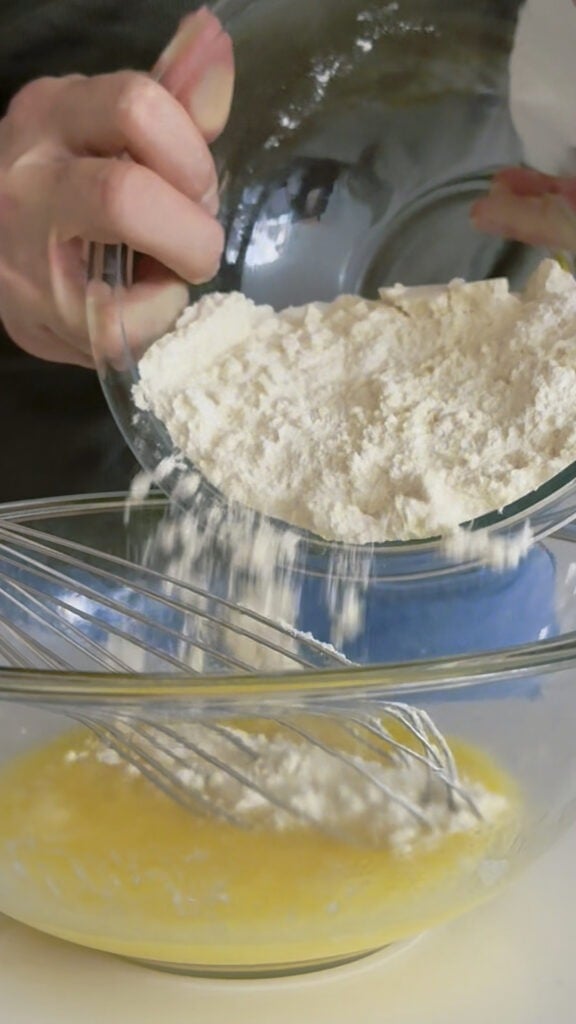 Dry ingredients being added to high protein pizzelle batter