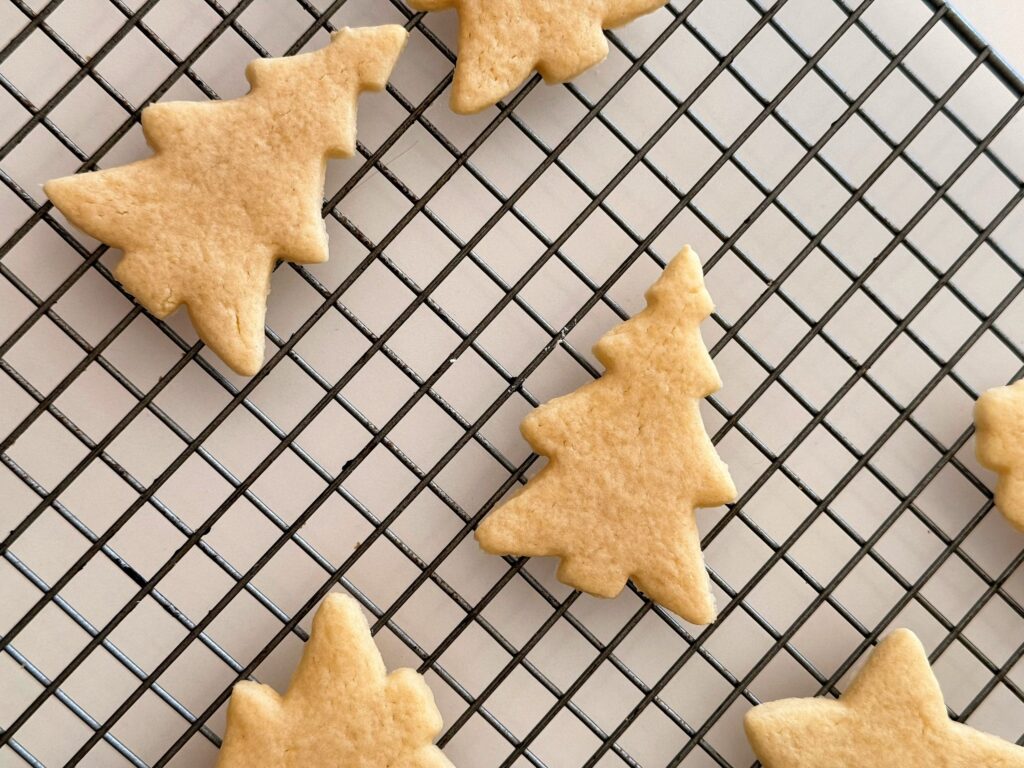 Unfrosted vintage sour cream cut out cookies on cooling rack