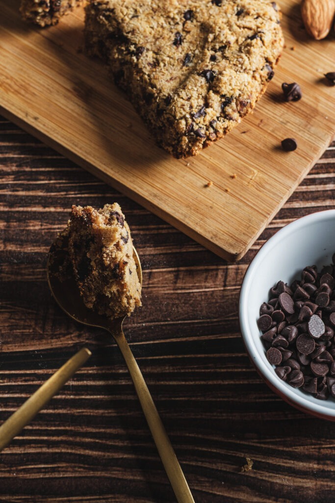 Large chocolate chip skillet cookie with spoon