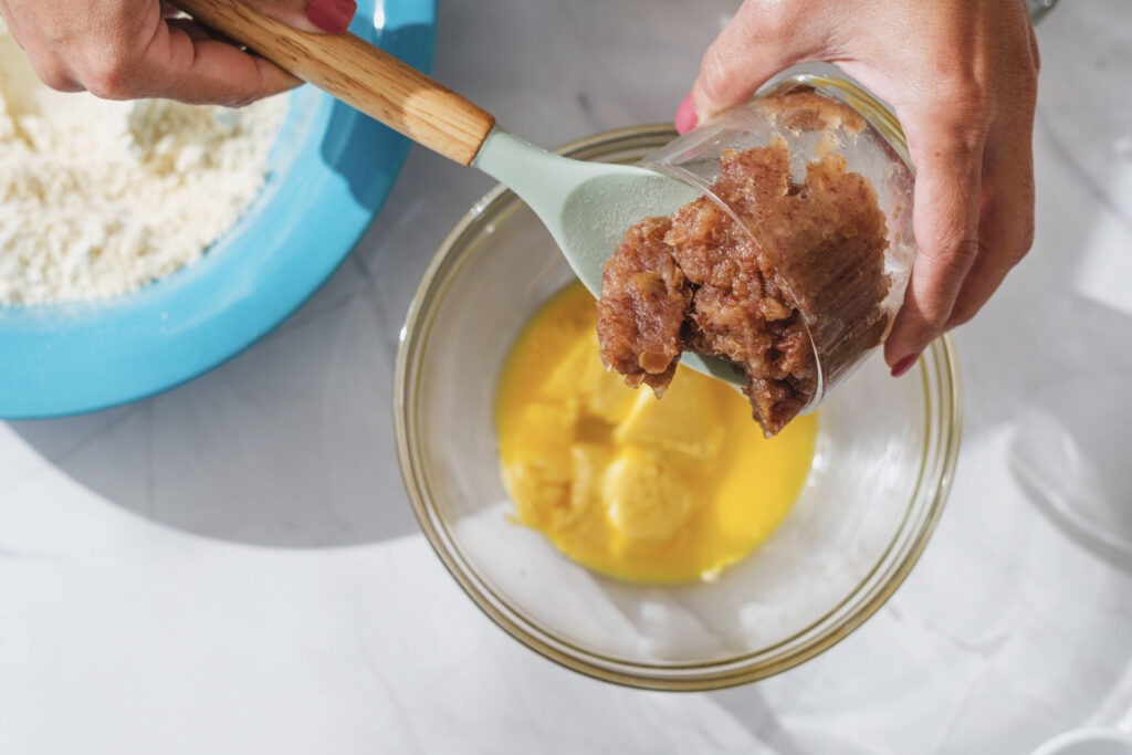 Adding brown sugar mixture to eggs