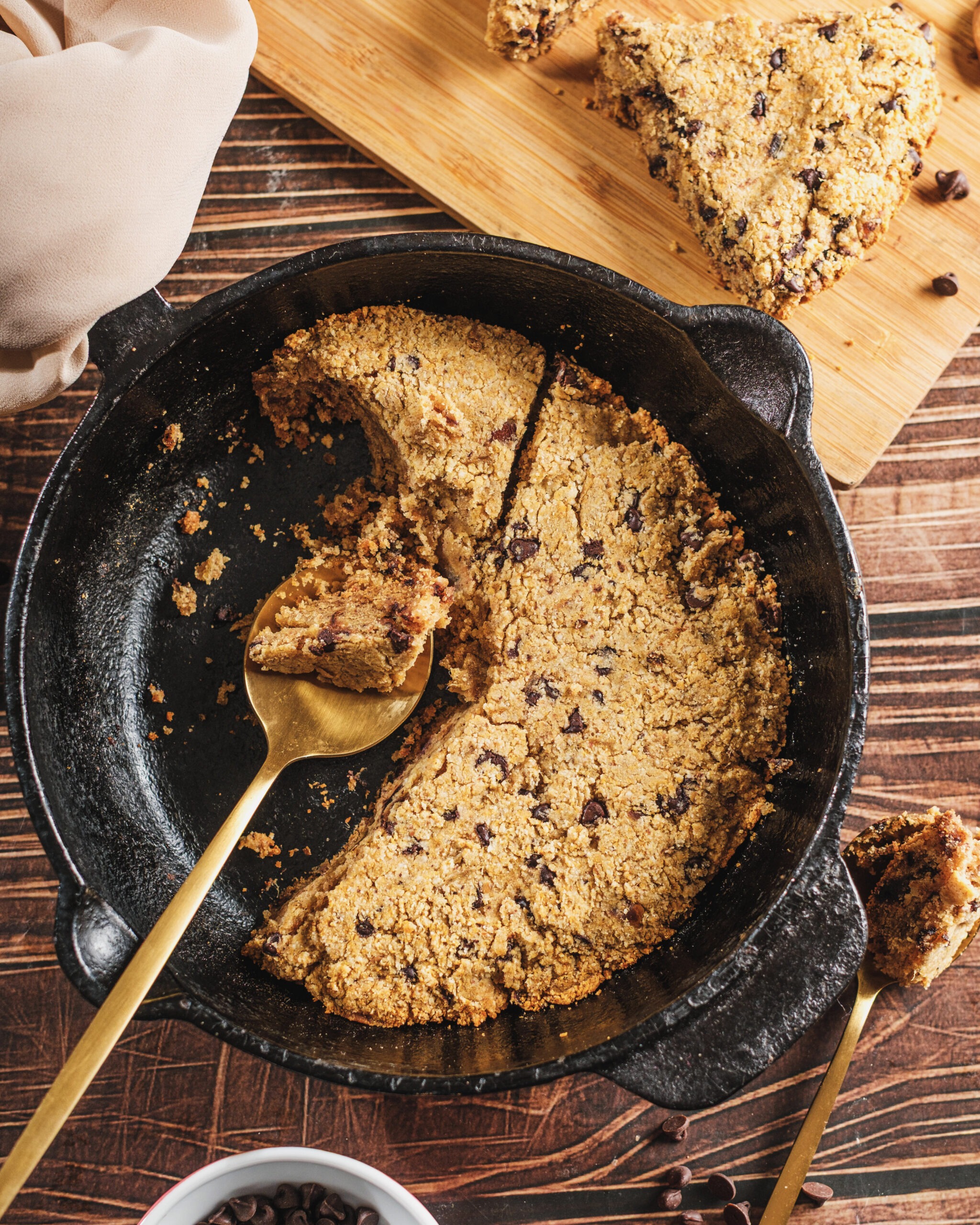 Skillet cookie partially sliced with spoon