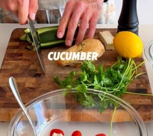 Adding Cucumber to Mediterranean Chicken Salad