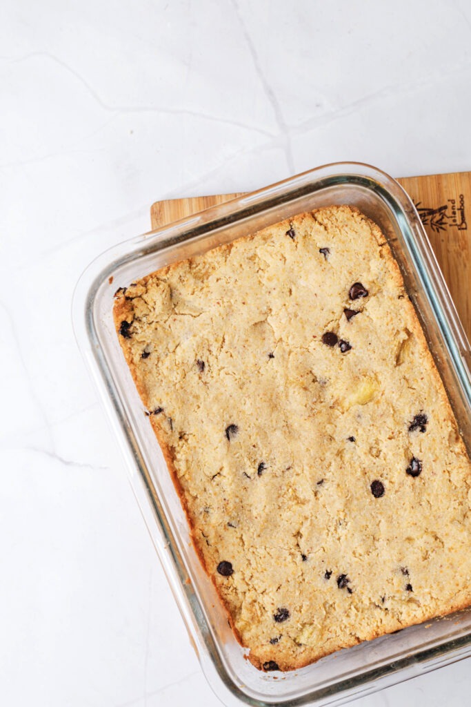 Gluten-free protein blondie batter spread in baking dish