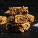 Gluten-free protein blondies stacked on black surface