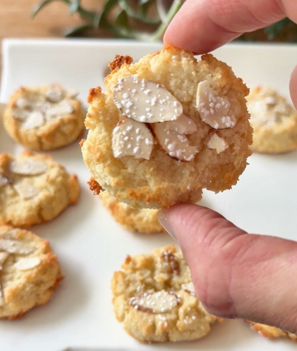 Hand holding a high protein amaretto cookie