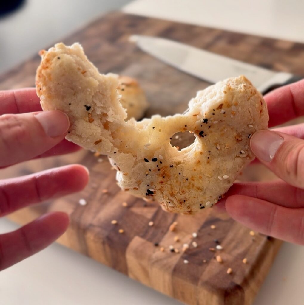 Gluten-free cottage cheese bagel torn open to show fluffy interior