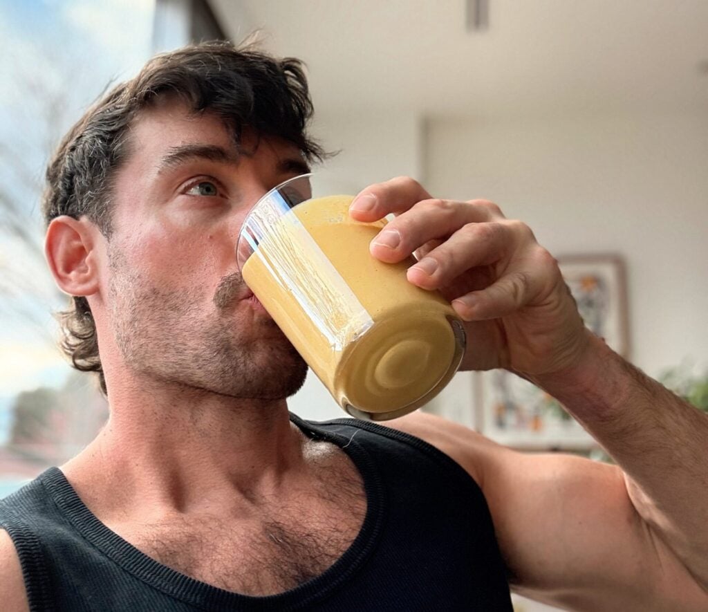 Founder Drinking Smoothie Side Angle