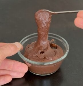 Low calorie Nutella-style chocolate spread being lifted with a spoon