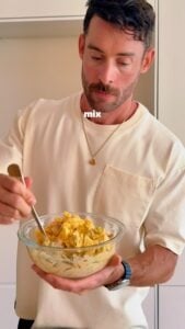 Mixing a bowl of high protein egg salad