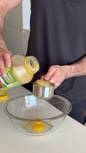 Mixing wet ingredients for high protein snickerdoodle muffin batter