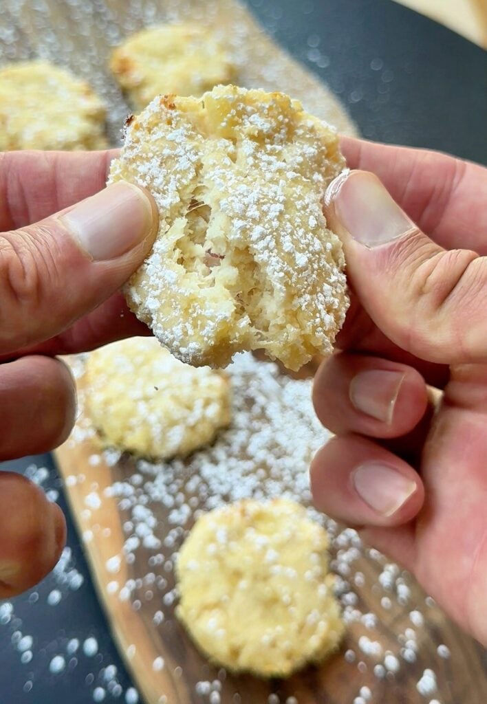 Pineapple cookies dusted with powdered sugar on baking tray