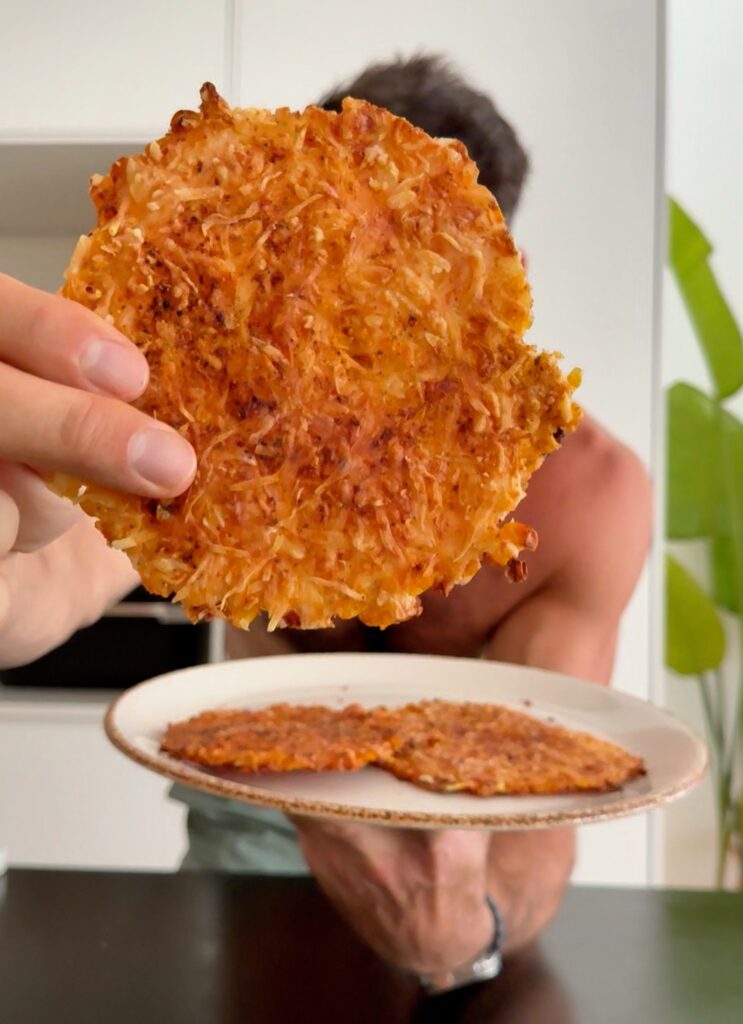 Close-up of a crispy cheesy corn tortilla showing golden edges and melted cheese