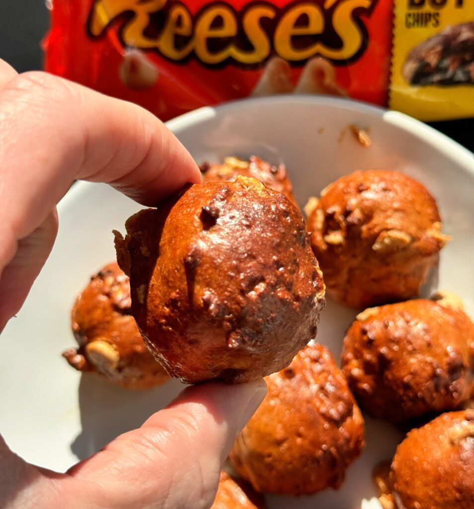 Chocolate Peanut Butter Protein Balls single in hand