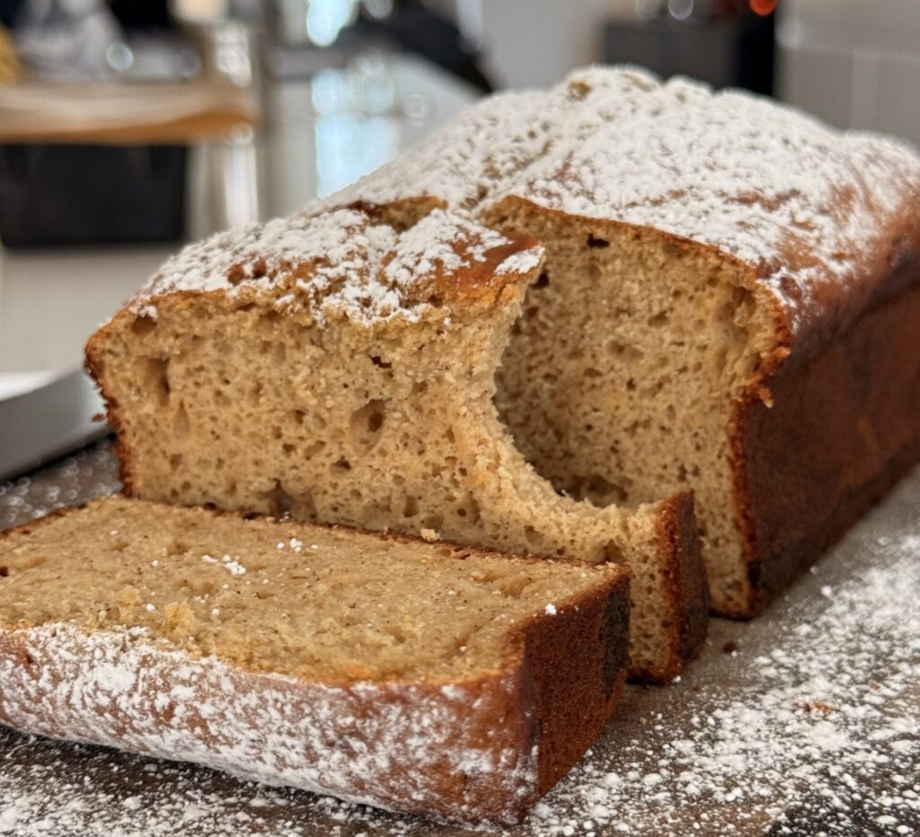 Slices of moist cinnamon protein pound cake showing the dense applesauce-based crumb.