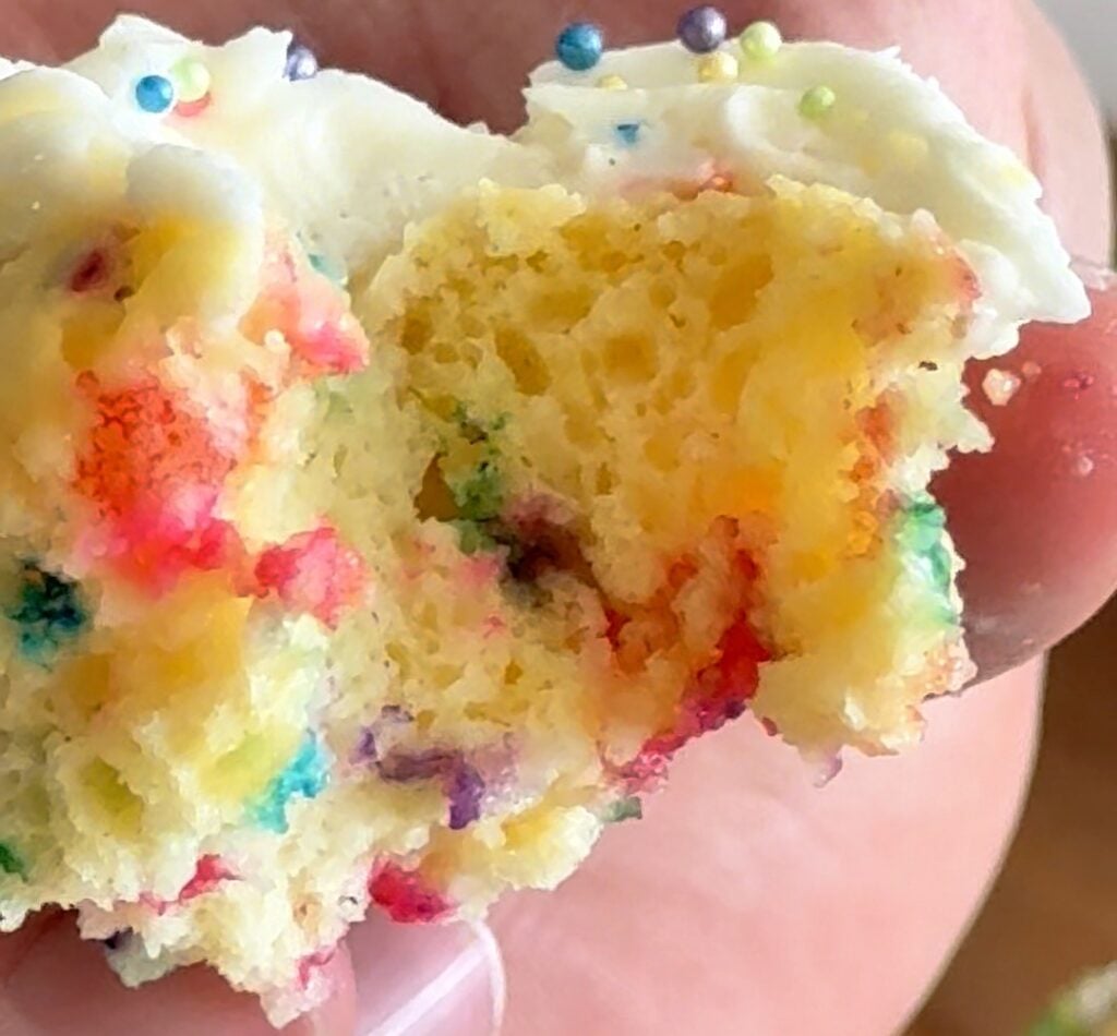 Close up of the moist crumb of a funfetti protein cupcake.