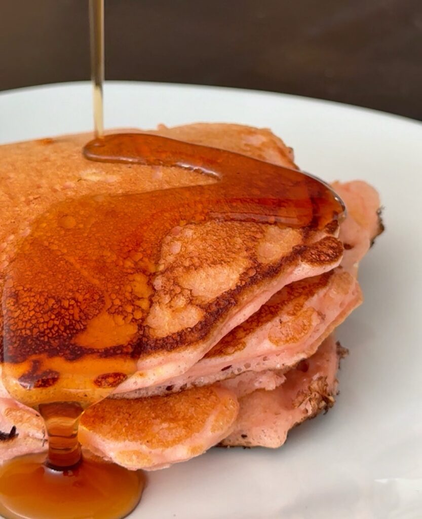 High Protein Strawberry Pancakes Poured Syrup
