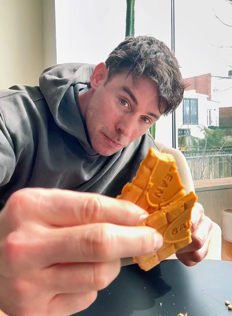 Jacob eating a Butterscotch High Protein Chocolate Bar