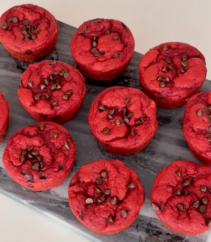Red velvet protein cupcakes baked in a muffin pan
