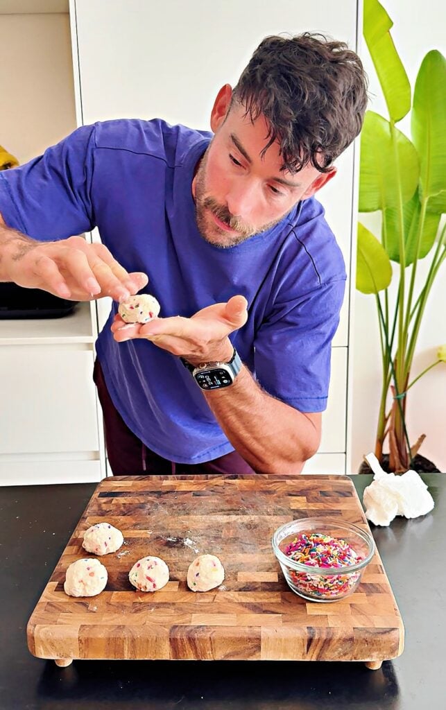 Jacob rolling high protein donut hole dough before air frying