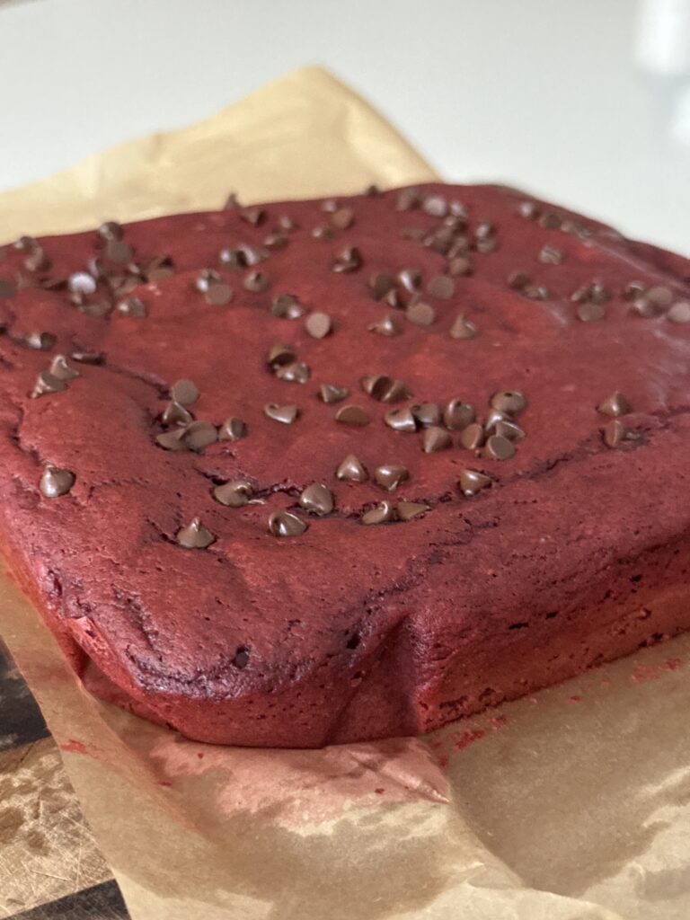 side view whole close up of red velvet protein brownie