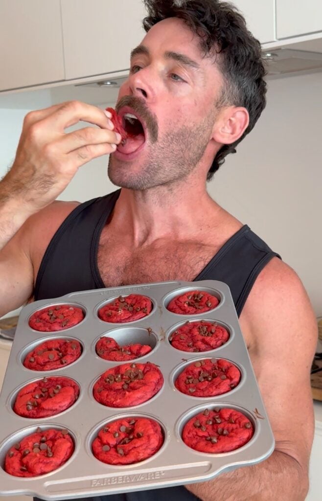 Jacob eating a red velvet protein cupcake