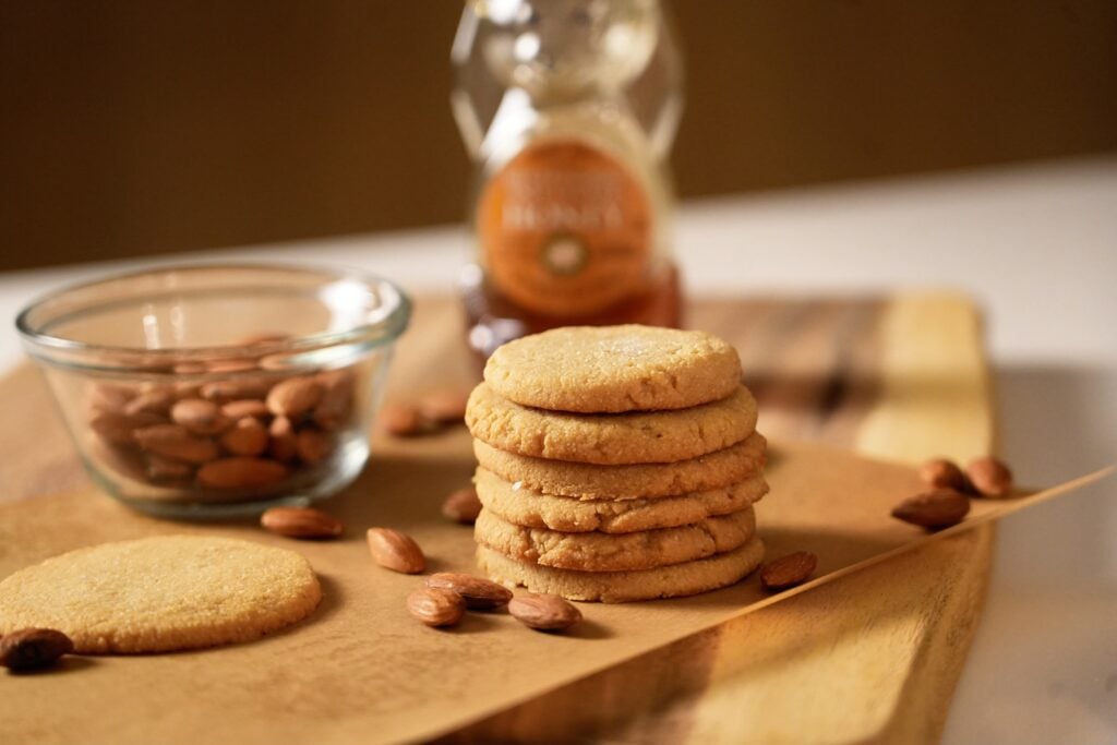 2-ingredient almond honey cookies on board with almond