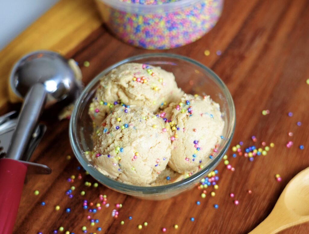 Detailed texture shot of high protein cookie dough showing mix-ins.