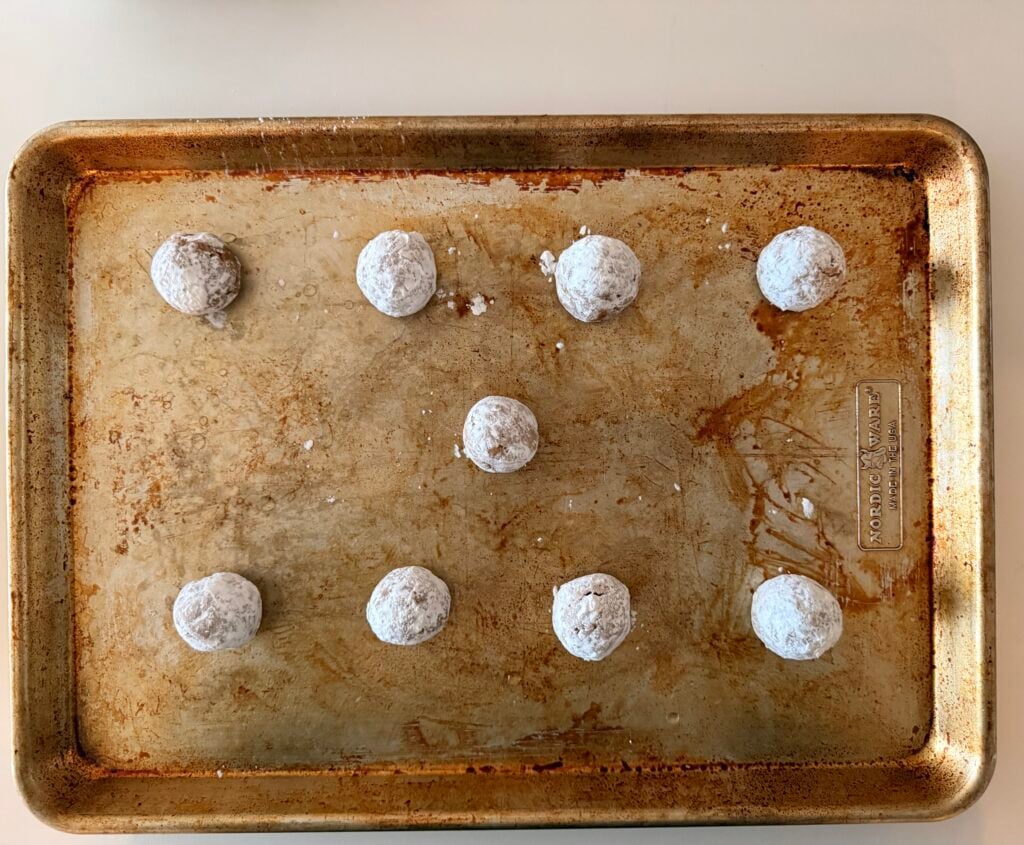dough rolled into balls and dipped in sugar