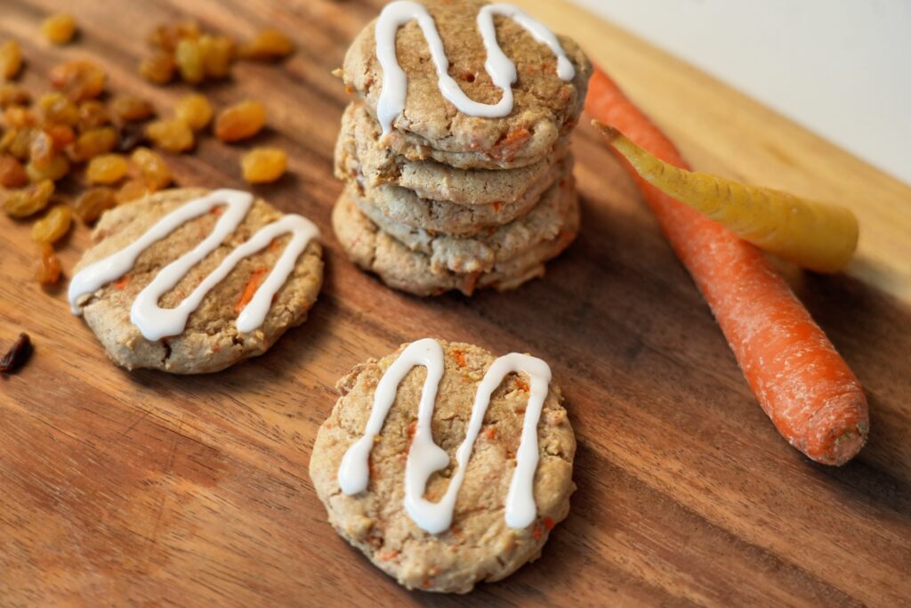 high protein carrot cake cookie on board with more