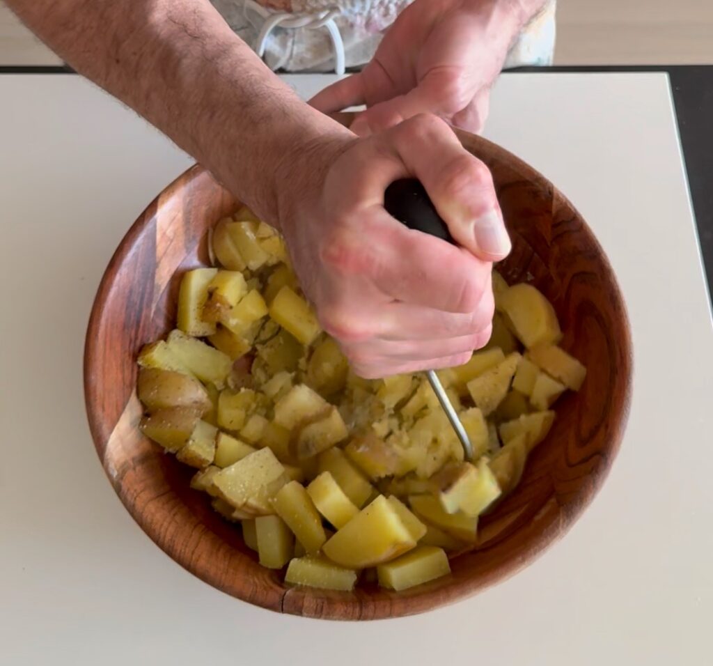 mashing potatoes for the waffles