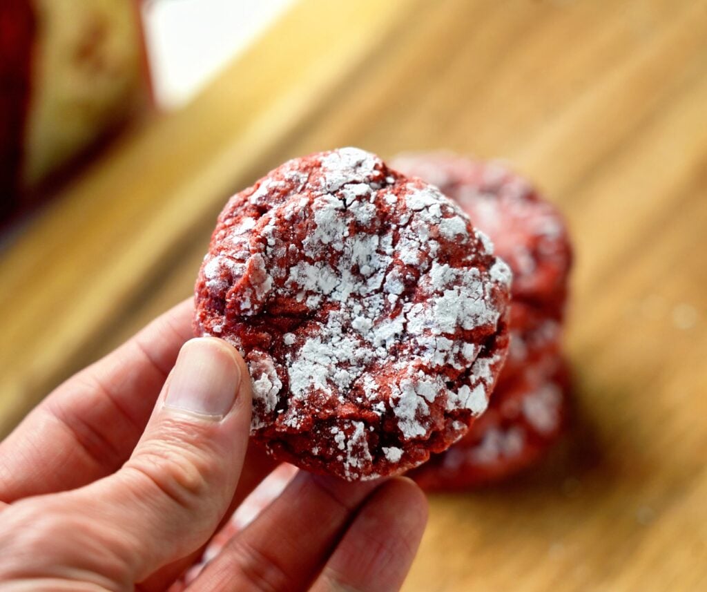 red velvet crinkle cookie in hand