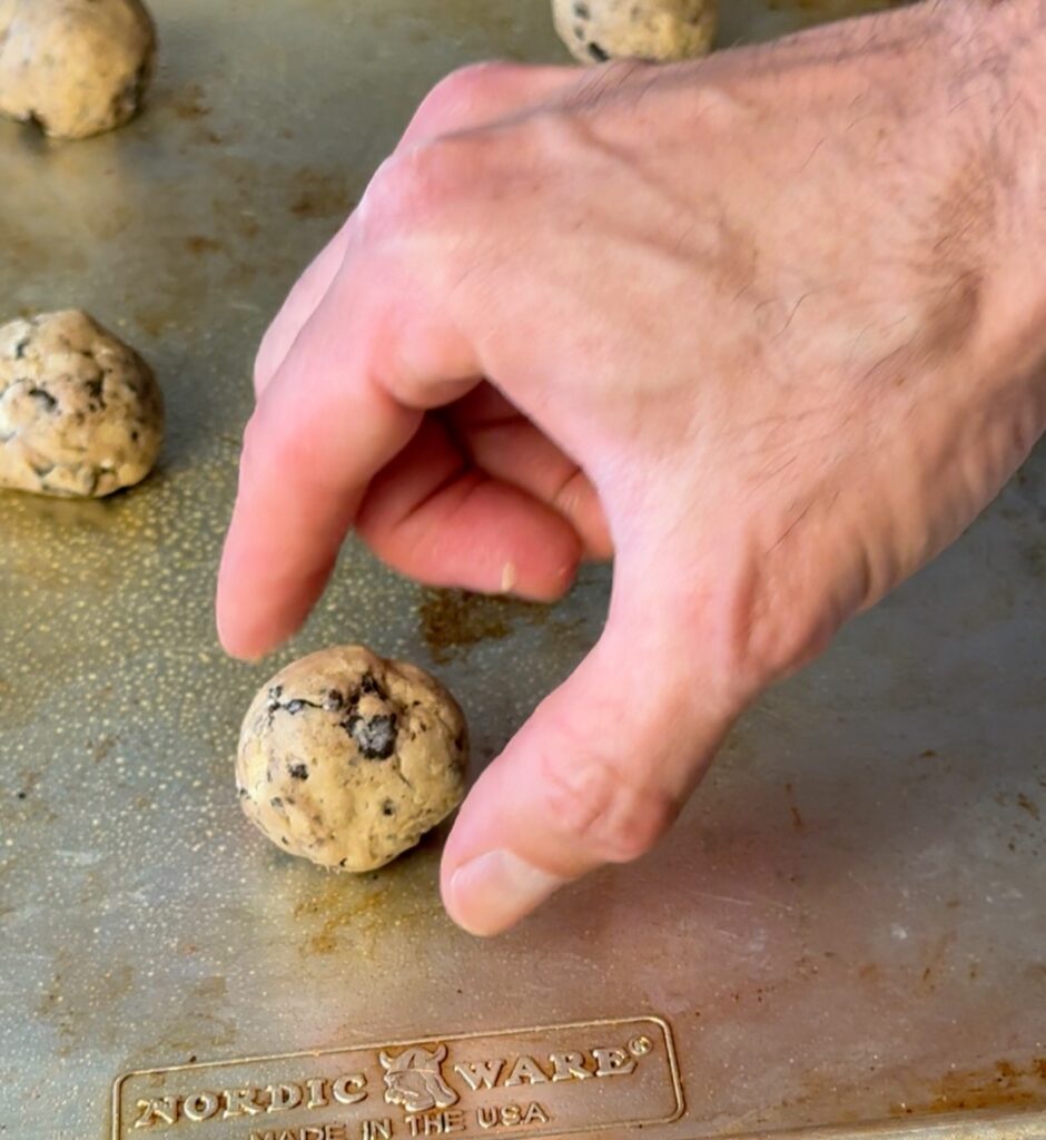 rolling and shaping the oreo donuts