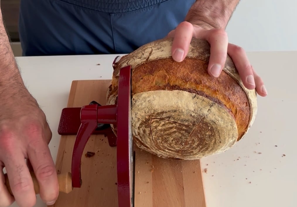cutting orange sourdough